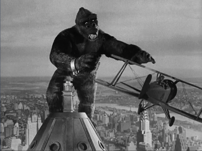 King Kong, who was animated via stop-motion, atop the Empire State Building fighting an airplane.
